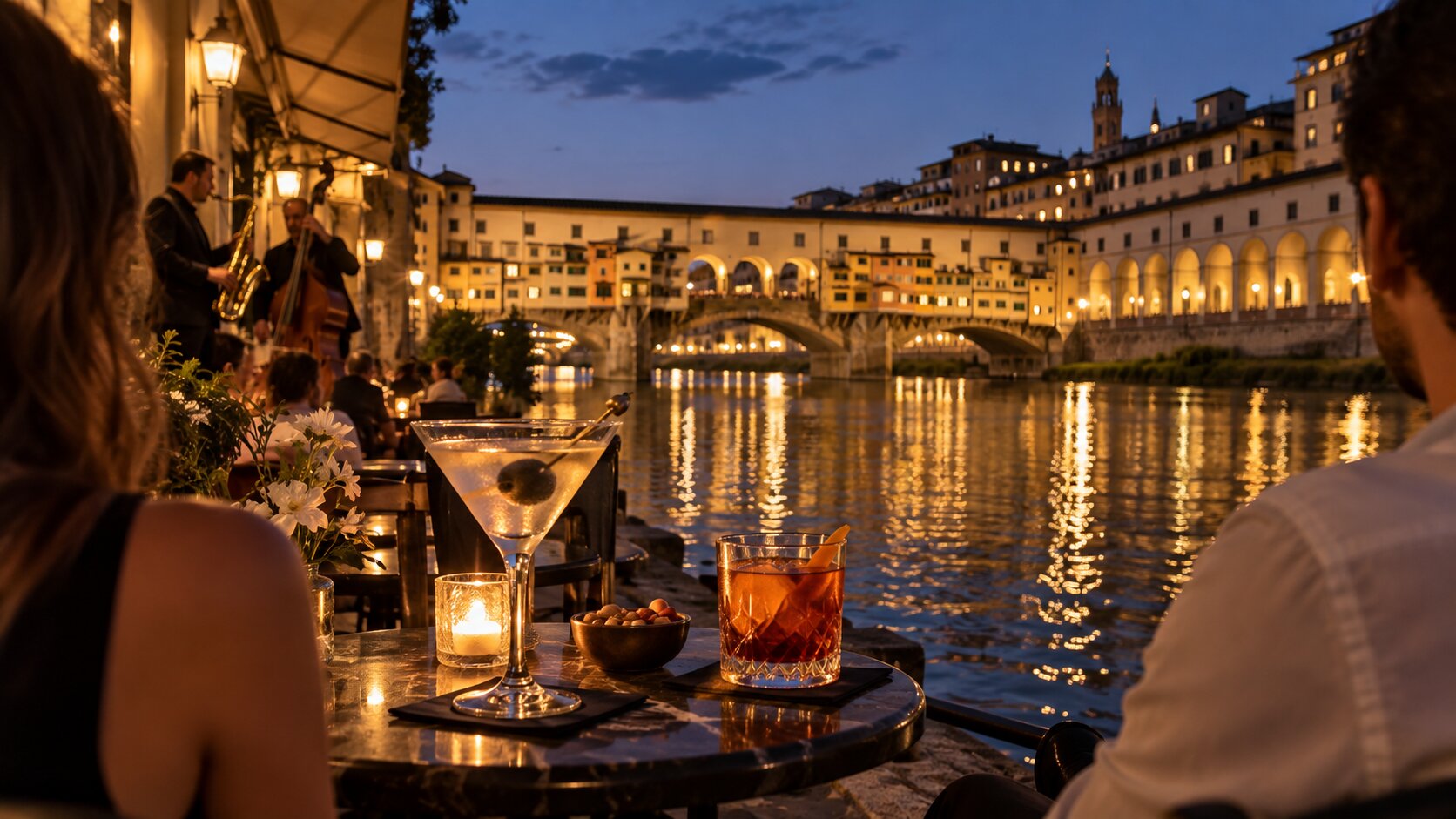 Cocktails overlooking Ponte Vecchio at night