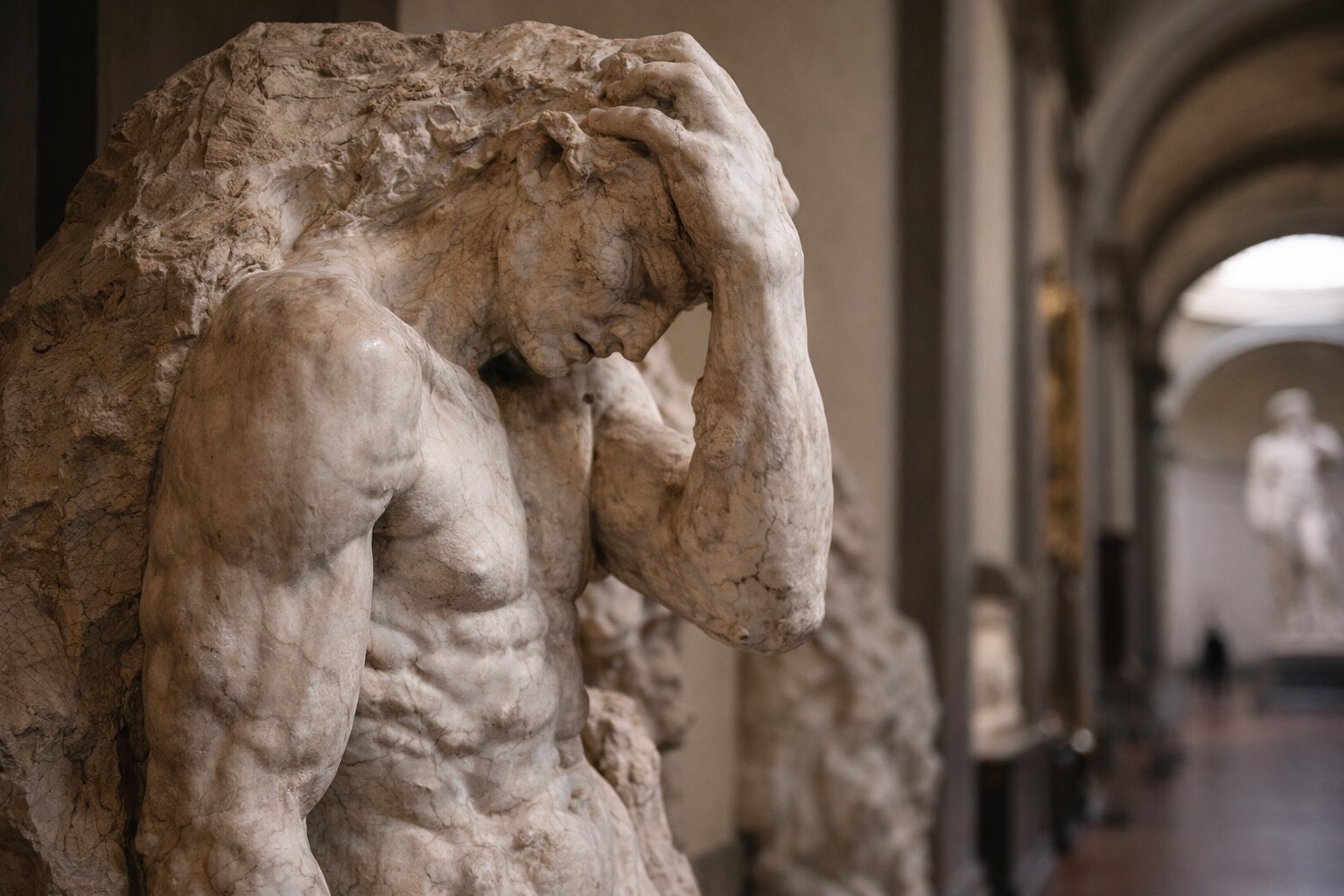 Detail of Michelangelo’s unfinished Prisoners sculpture at the Accademia Gallery in Florence