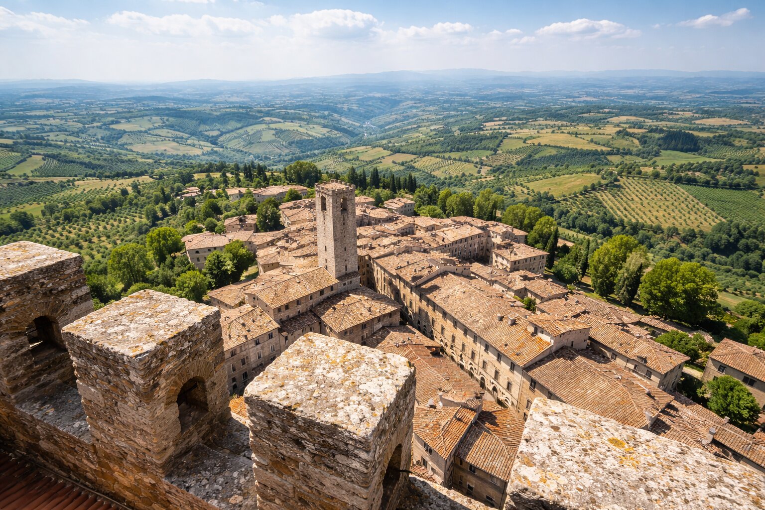anoramic view from Torre Grossa over San Gimignano rooftops and Tuscan countryside