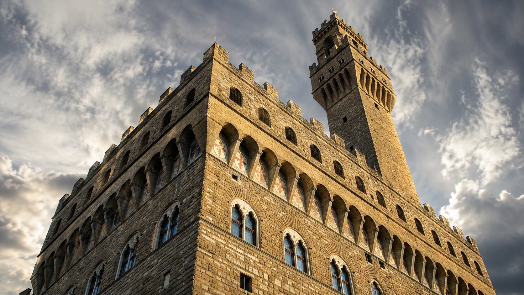 Low-angle view of Palazzo Vecchio's fortress-like architecture